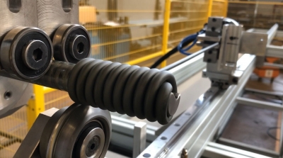 BENDING MACHINE FOR COILED ELEMENTS